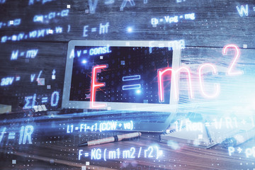 Desktop computer background and formula hologram writing. Double exposure. Education concept.