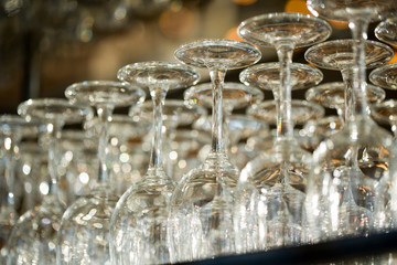 Wine glasses in row on bar counter close-up