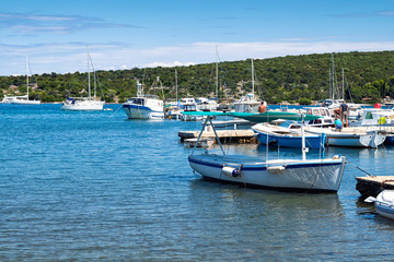 Fototapeta na wymiar fishing boats in harbour of Ilovik island, Croatia.
