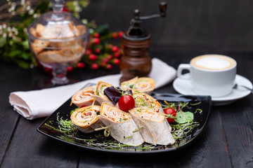 doner kebab with ham and cheese in a plate with microgreen