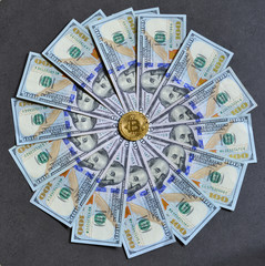 Golden bitcoin on USD 100 billnotes