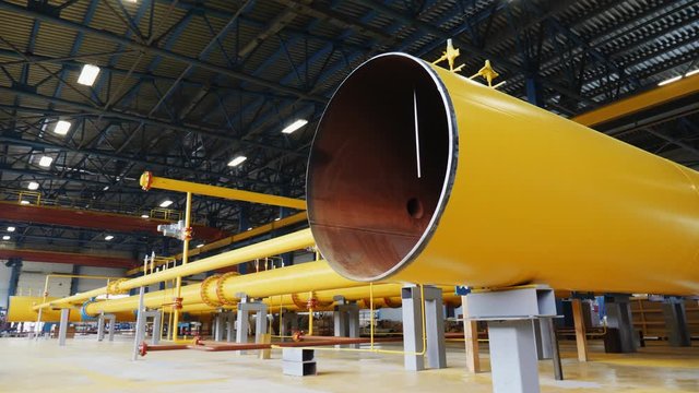 camera moves out of wide metal tube at assembled system