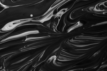 Liquid bright background in black and white tones. Abstract background image.