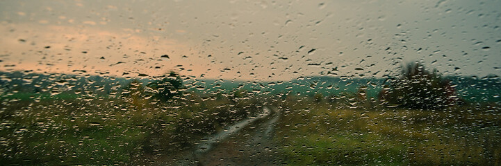 Car glass covered with drops of water. Web banner.