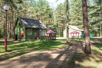 wooden camping arbors  with all conviniences in a pine forest