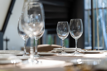 Beautiful table setting with glasses, plates and napkins. General form-2.