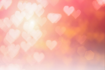 Blurred background of Valentine's day concept. Pink Valentines Day Card. Pastel color tone soft have gradient pattern. Multicolor white pink, orange and red hearts blur wallpaper in love bright sexy..