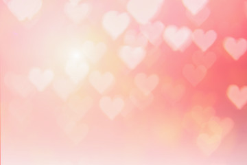 Blurred background of Valentine's day concept. Pink Valentines Day Card. Pastel color tone soft have gradient pattern. Multicolor white pink, orange and red hearts blur wallpaper in love bright sexy..