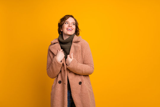 Portrait of her she nice attractive lovely pretty fashionable dreamy cheerful cheery girl wearing warm cosy clothing good weather isolated on bright vivid shine vibrant yellow color background