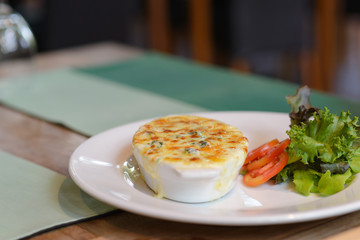 Baked spinach and cheese on dining table. delicious Italian food cuisine