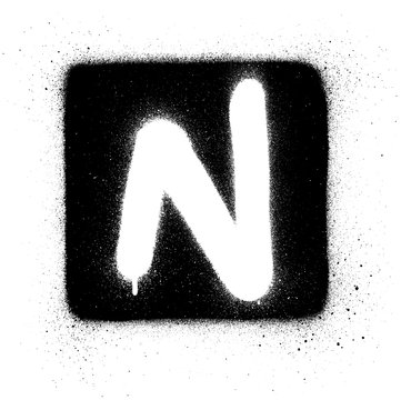 graffiti N font sprayed in white over black square