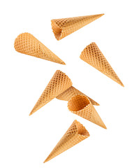 Falling Empty ice cream cone, isolated on white background, clipping path, full depth of field