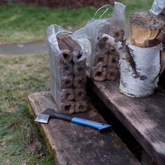 axe and firewood briquettes