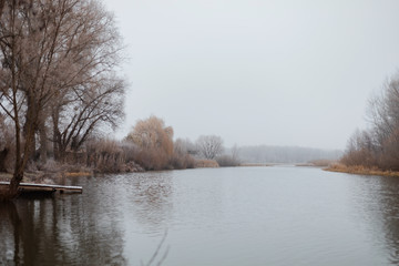 winter landscape river near the banks bare trees