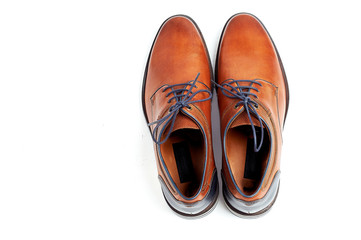 luxurious male brown and blue leather shoes isolated on a white, top view