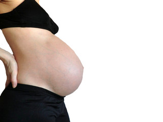 Fototapeta premium Belly of a pregnant woman with black clothes