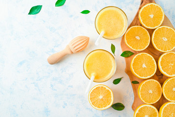 orange juice in a glass, top view, slices of oranges, straw, healthy lifestyle concept