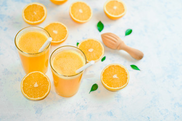 orange juice in a glass, top view, slices of oranges, straw, healthy lifestyle concept