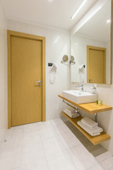 Fototapeta na wymiar Interior of a luxury hotel bathroom with glass shower cabin