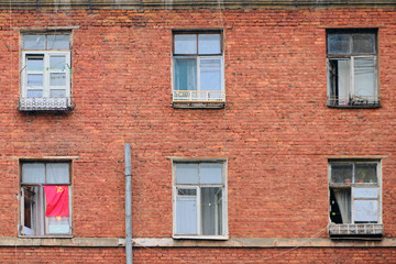 Fototapeta na wymiar Red flag of the Soviet Union on an old brick building
