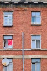 Red USSR flag hung on an old window in Russia, Moscow