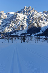 Fototapeta na wymiar Winter landscape at early morning in small village and ski resort Werfenweng, Austria, Europe.