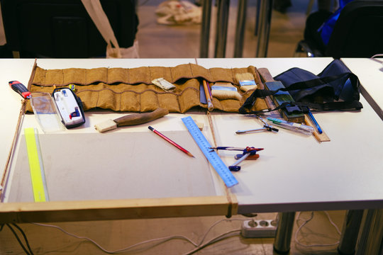The carpenter tools in the workshop for marking and working with wood and a pair of compasses, pencil, ruler