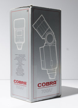 london, england, 08/08/2019 A cobra 700 af photography speed light flash gun for studio photography. Retro vintage on camera flash gun for professional photography. isolated flash.