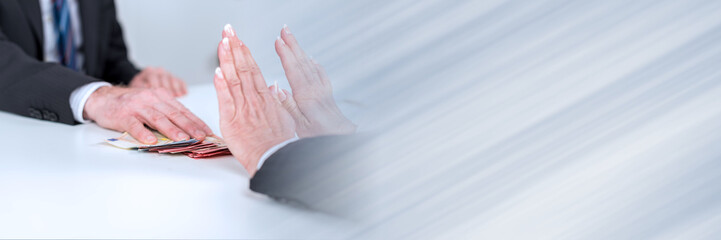 Woman hands rejecting an offer of money; panoramic banner