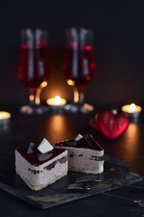 Fototapeta na wymiar chocolate cakes on a dark background with candles