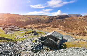 A partly restored slate building below Fleetwith Pike and Honister in the English Lake District on...