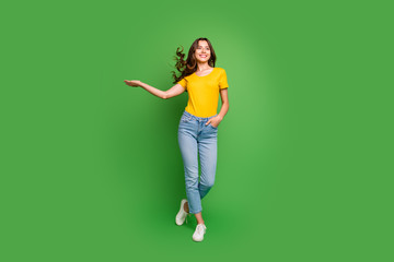 Full length body size view of nice attractive lovely slim fit thin dreamy cheerful cheery wavy-haired girl having fun throwing hair isolated on bright vivid shine vibrant green color background