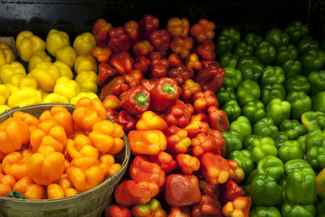 View of multicolored bell peppers on display in market