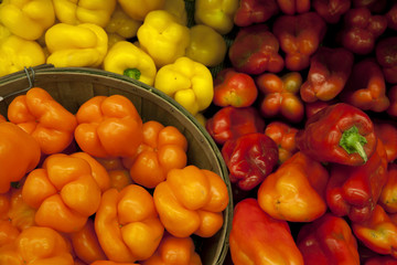 Multicolored bell peppers on display in market