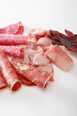 fresh delicious assorted sliced meat isolated on white