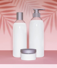 Mockup kit containers for cosmetics on a pink background - 3D illustration