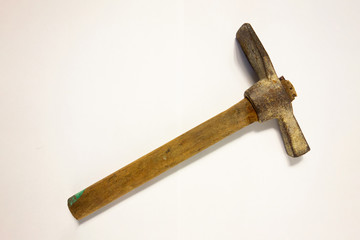 Miner hammer like pickaxe or mattock on white isolated background with shadow. Closeup view of...