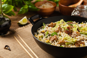 Fried veal, with rice, Chinese cabbage and mushrooms. Sprinkled with sesame and soy sauce.