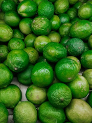 lots of green sour limes to eat as a background