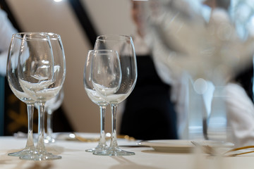 Chic and elegant, gold-plated cutlery and white plates, table setting with empty plates-2.