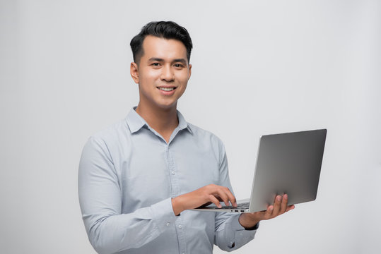 Happy Smile Asian Man Using Laptop With Positive Feeling On White. Business Success Concept.