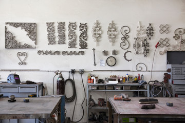 Metal designs on wall in workshop