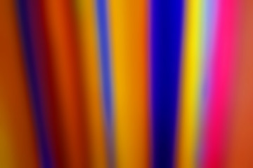 Blurred abstract background in the form of straight vertical ribbons