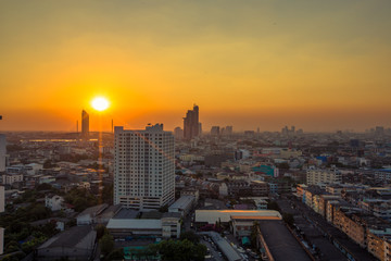 Naklejka na ściany i meble panoramic high-angle evening background of the city view,with natural beauty and blurred sunsets in the evening and the wind blowing all the time,showing the distribution of city center accommodation