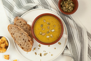Appetizing pumpkin cream soup. Vegetable soup.