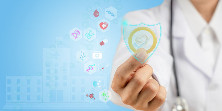 Close up doctor is showing a condom. Concept of condoms preventing various infections and preventing pregnancy. - Powered by Adobe