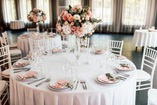 Festive table setting with a floral arrangement in the center and with a table number