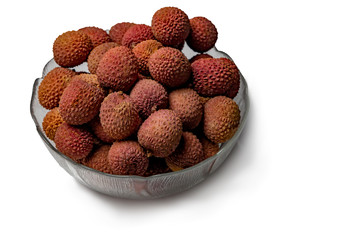 Lychee. Bowl with lychee isolated on a white background.