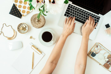 Woman hands working on laptop. Home office desk table workspace with laptop on white background....