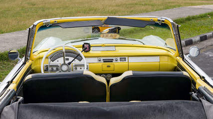 interior of a yellow cuban convertible classic car, cuba